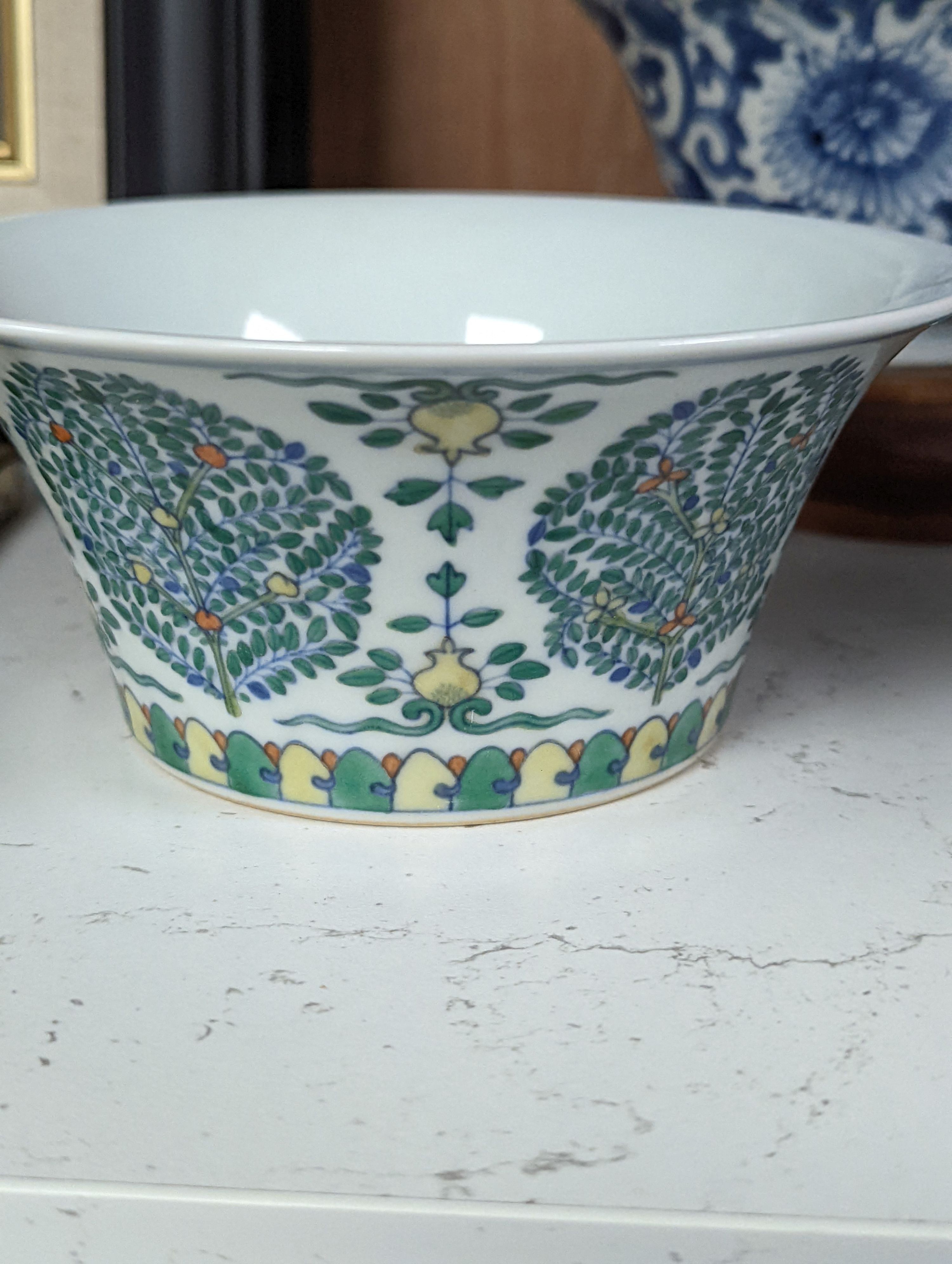 A Chinese blue and white bowl, Kangxi, 15cm. diam., a famille rose teapot stand, Yongzheng, and two doucai bowls
